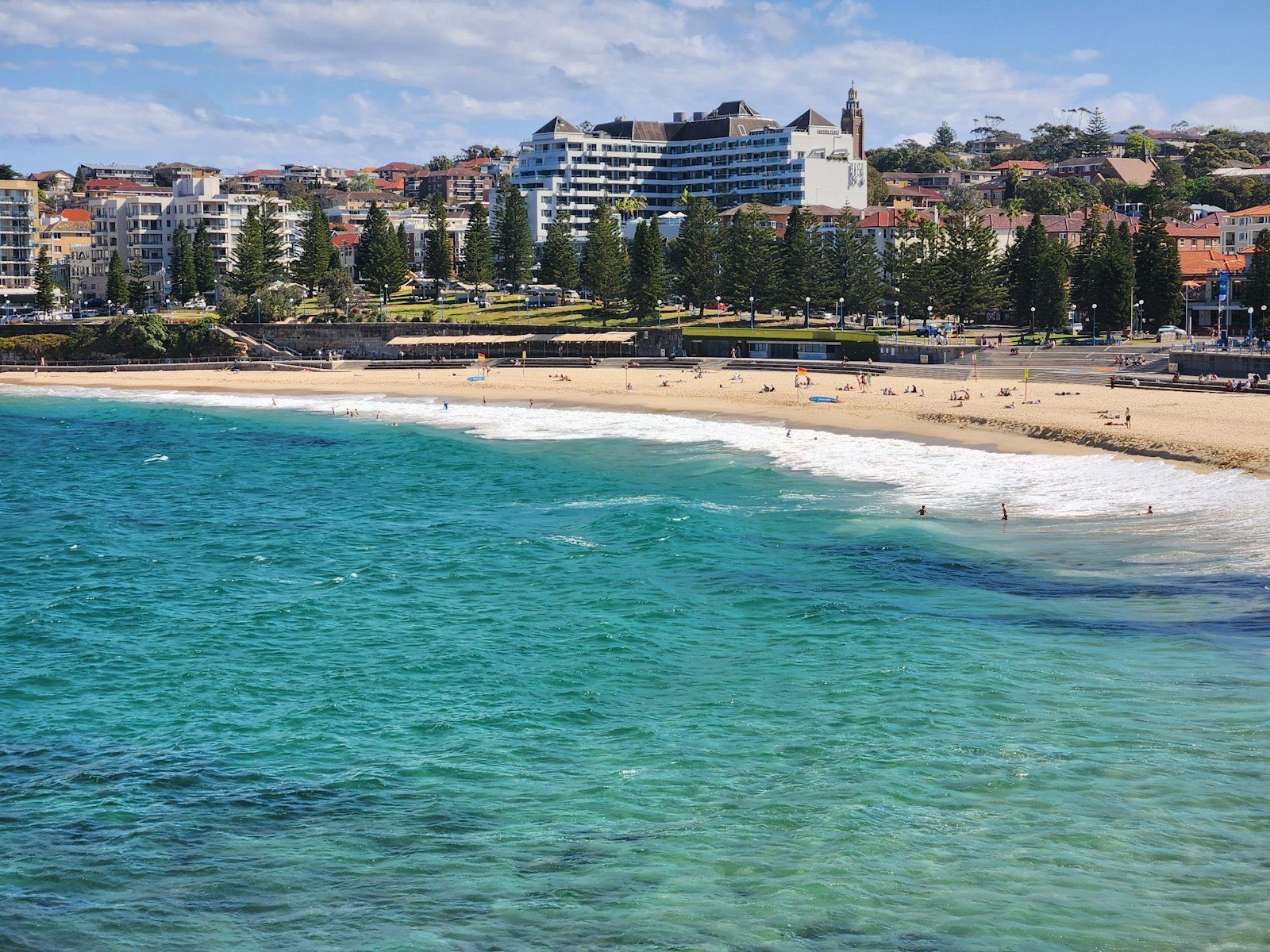A beach with buildings in the background